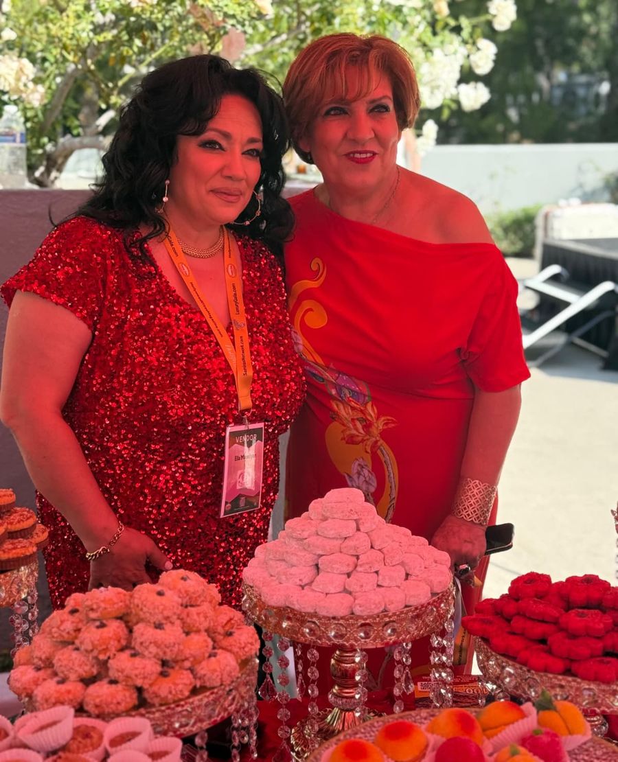 Ella with her dessert table at a vendor event